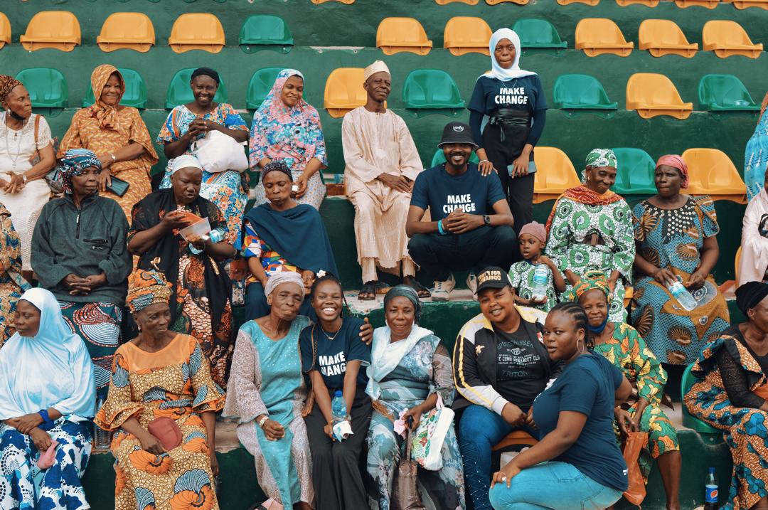 Dele Fayemi with a community group at an outreach event
